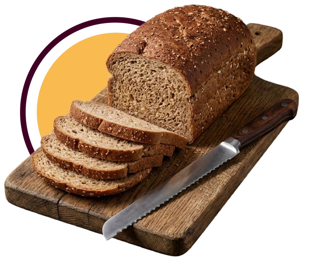 A loaf of bread on a cutting board with four pieces sliced